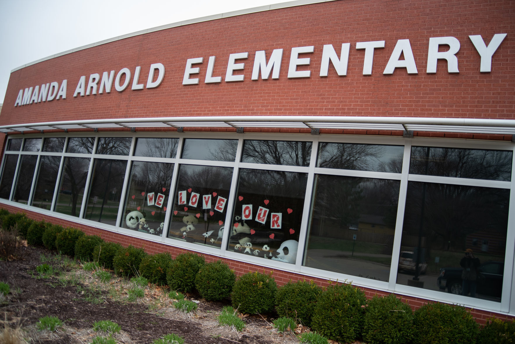 The principal of Amanda Arnold Elementary School created a message that says, ÒWe love our pandasÓ in the front window of the school.